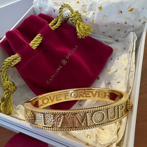L'Amour Toujour Hinged Bangle Gold
CAPUCINE DE WULF
In original box, never worn